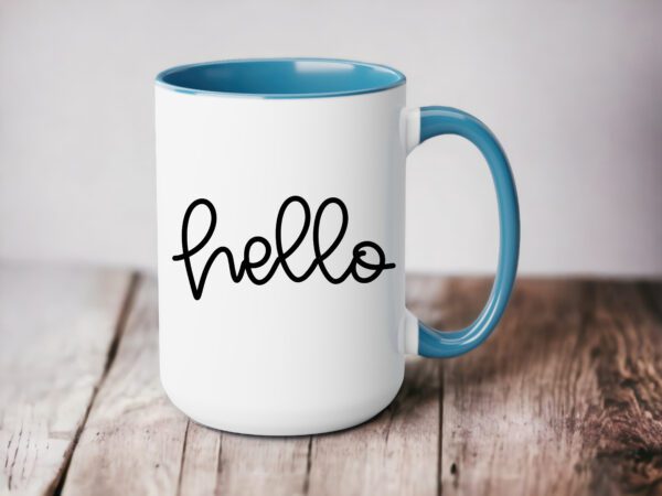 A coffee mug with the word hello written on it.