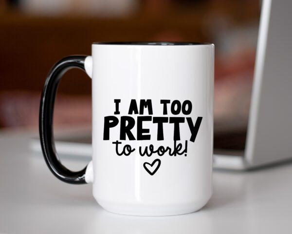 A coffee mug that says i am too pretty to work.