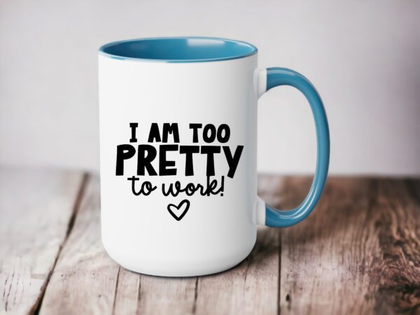 A coffee mug that says i am too pretty to work.