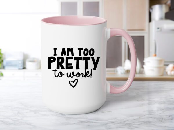 A pink coffee mug sitting on top of a counter.