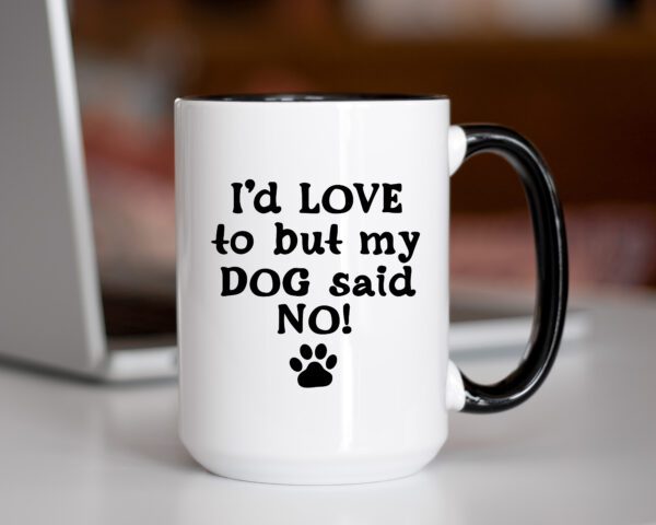 A coffee mug that says i 'd love to but my dog said no.