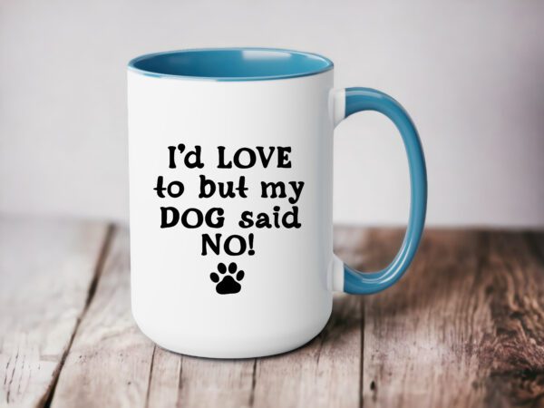 A coffee mug that says i 'd love to but my dog said no.