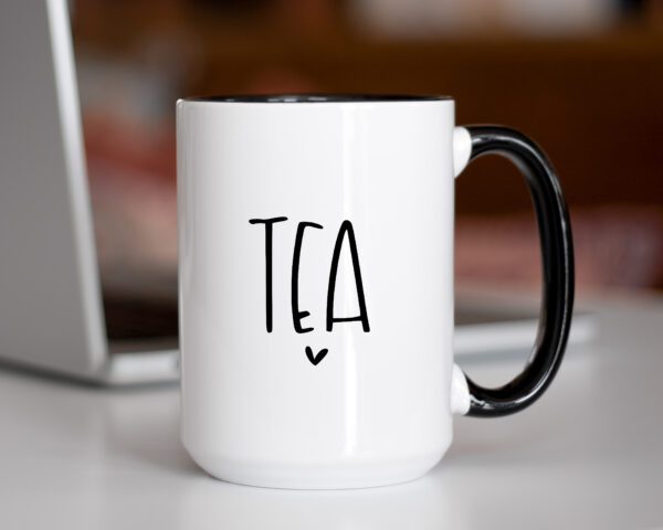 A coffee mug with the word tea written on it.