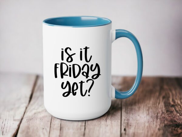 A coffee mug that says is it friday yet