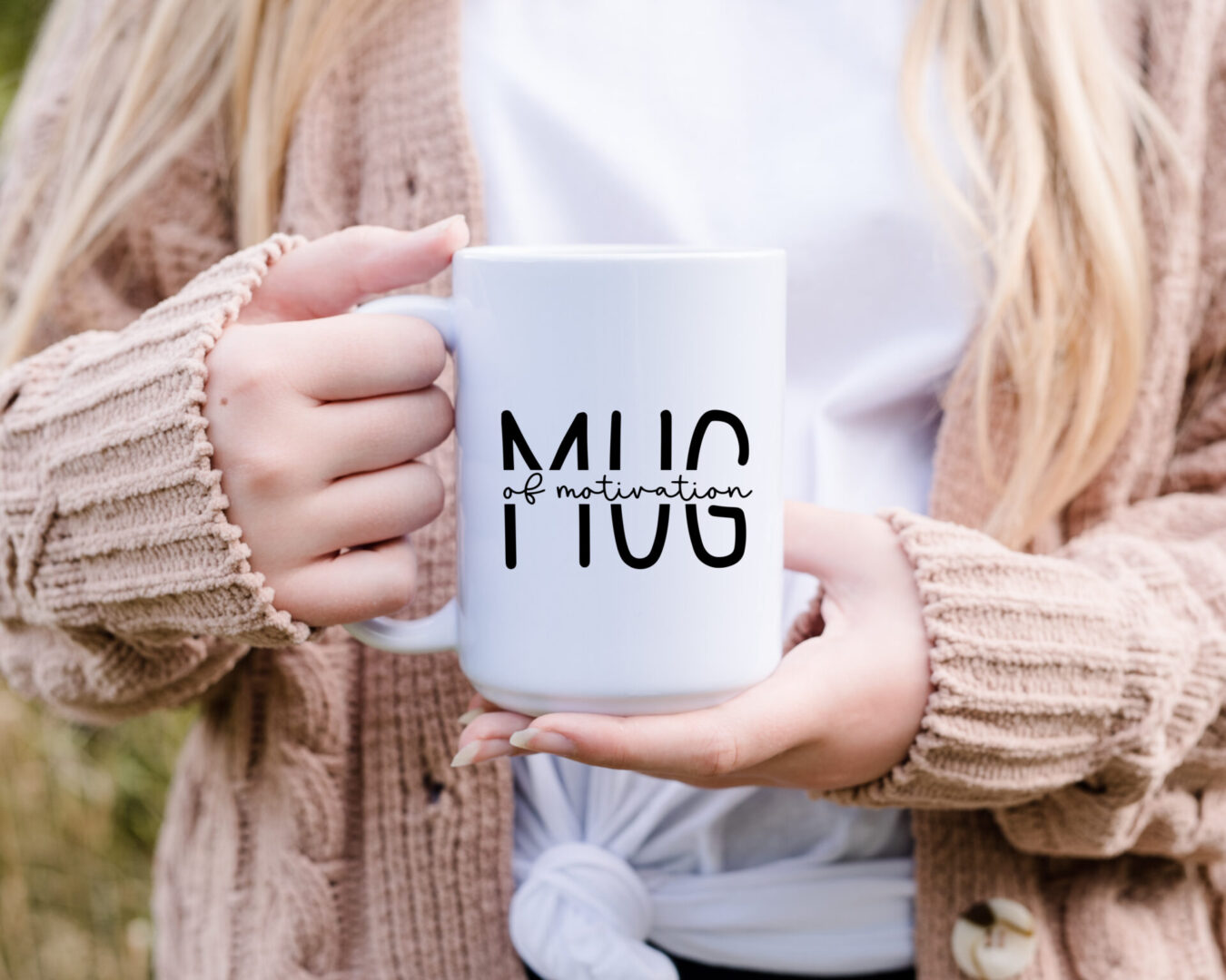 A person holding a mug with the words " mug ".