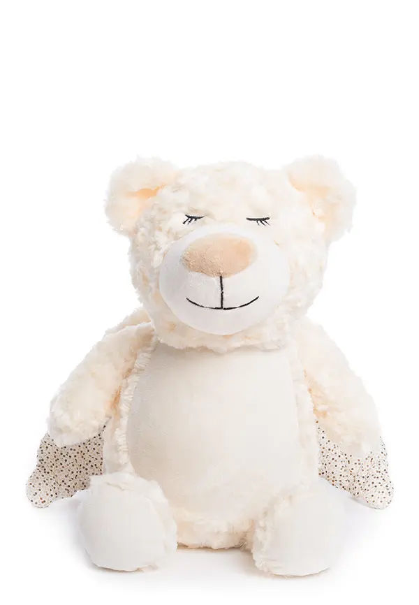 A white teddy bear with its eyes closed.