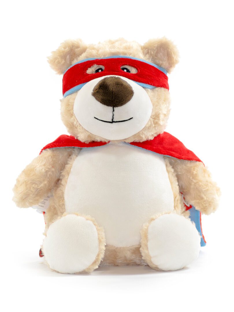 A stuffed bear with a red mask and a cape.