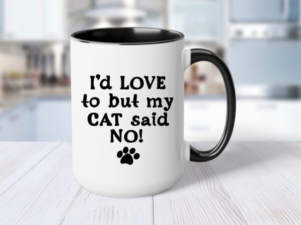 A coffee mug that says i 'd love to but my cat said no.