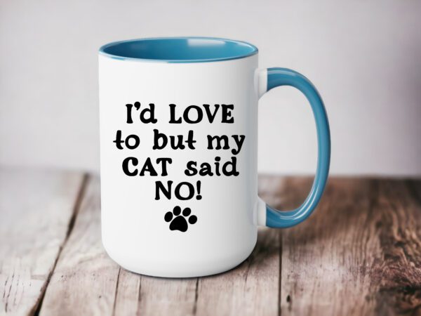 A coffee mug that says i 'd love to but my cat said no.