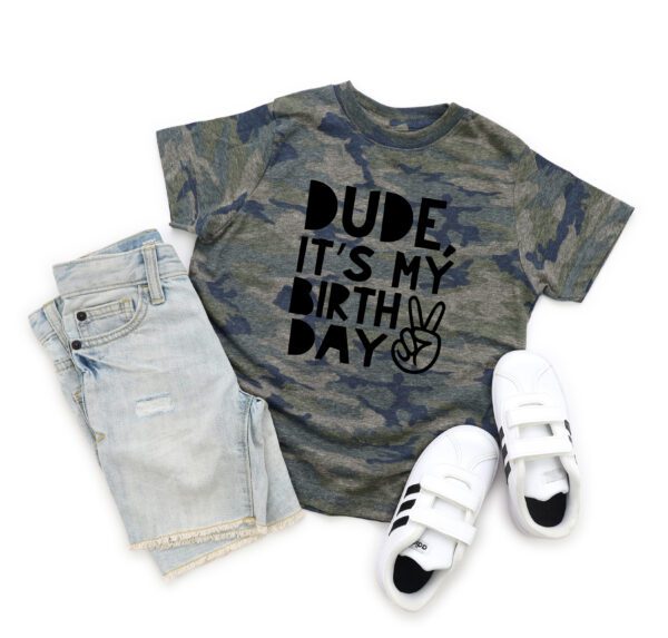 A pair of jeans and shoes with a t-shirt that says " dude, it's my birthday ".