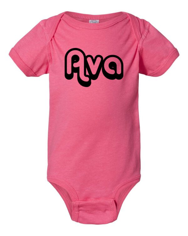 A pink onesie with the name ava written in black