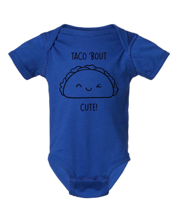 A blue onesie with a taco ' bout cute on it.