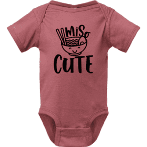 A baby onesie with the words miss cute written on it.