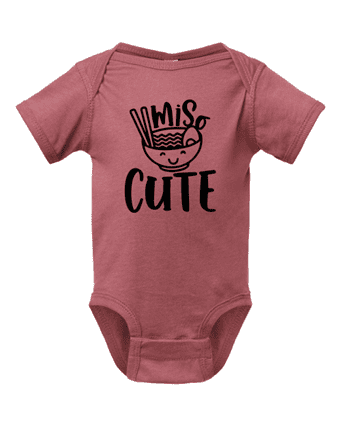 A baby onesie with the words miss cute written on it.